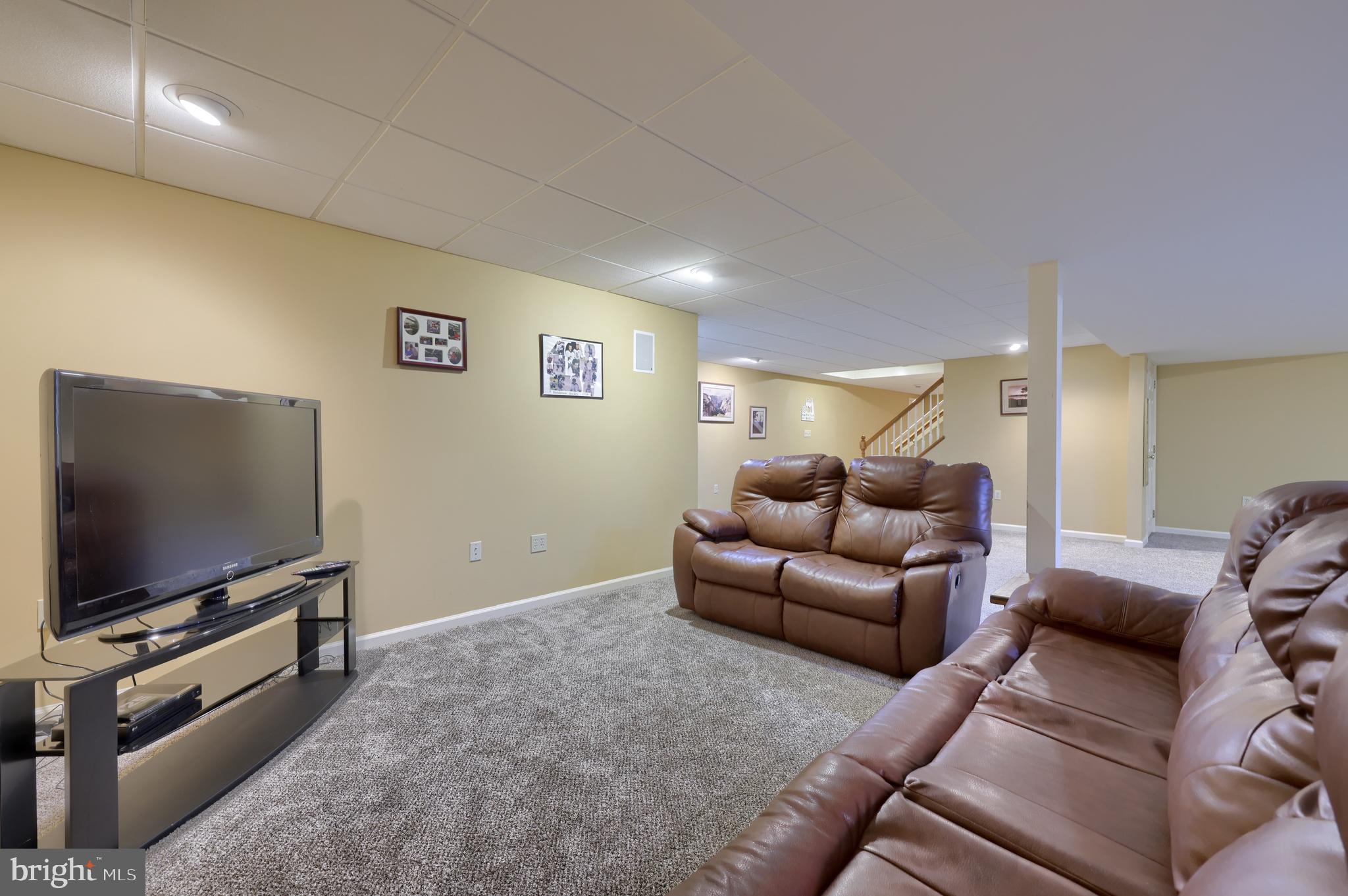128 Hammersmith Lane Lititz, PA 17543 - Photo 45 of 65 a living room with furniture and a flat screen tv