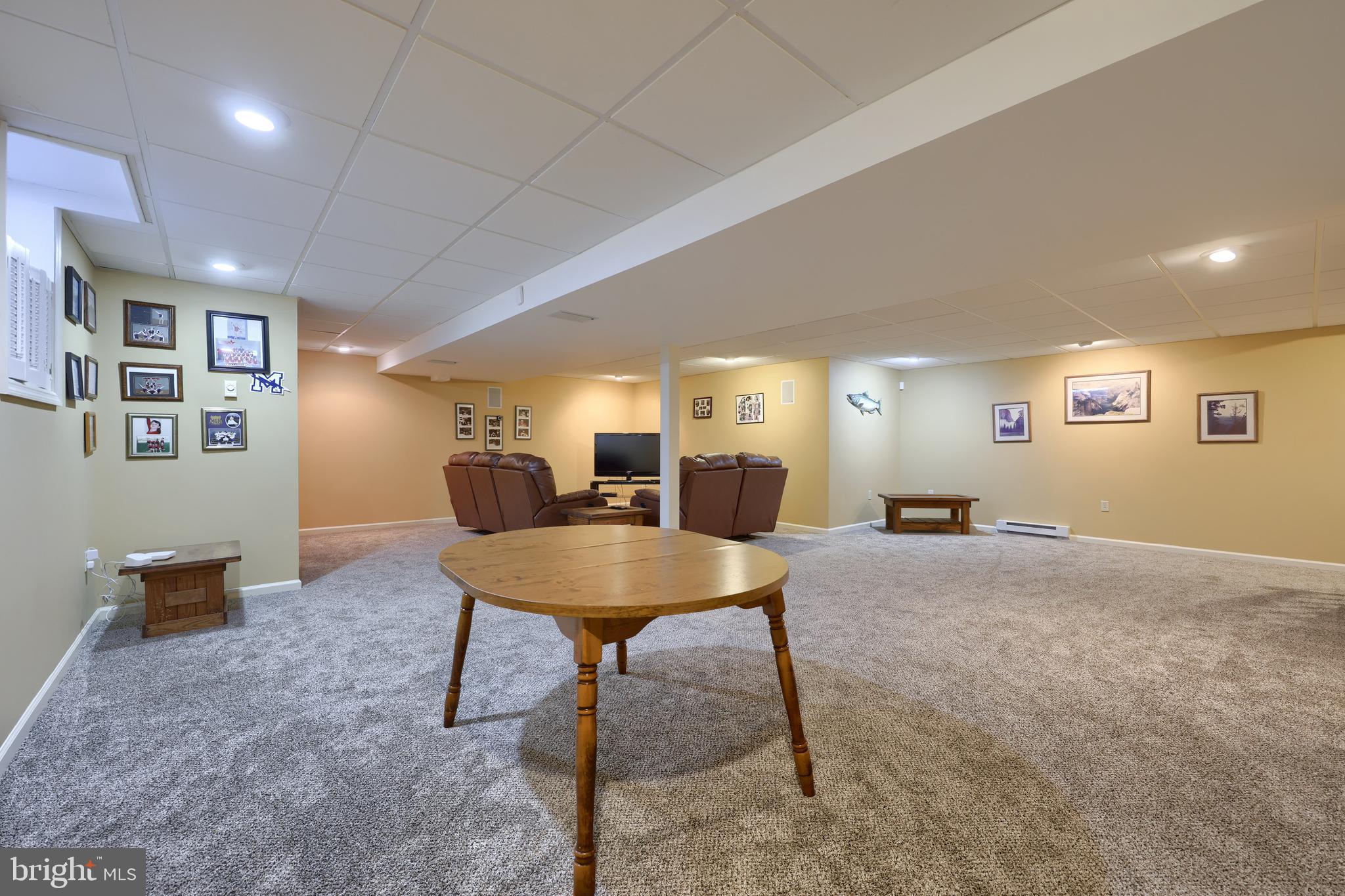 128 Hammersmith Lane Lititz, PA 17543 - Photo 47 of 65 a living room with furniture and a dining table