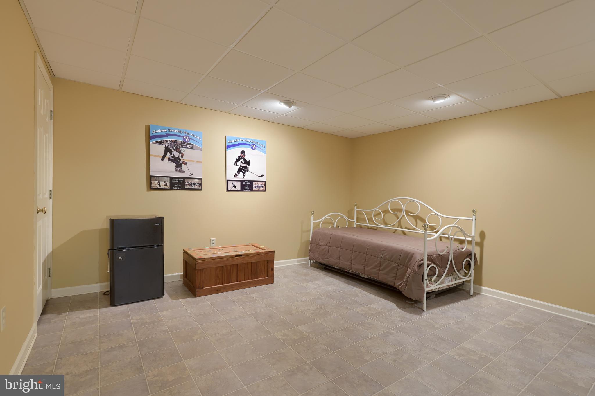 128 Hammersmith Lane Lititz, PA 17543 - Photo 49 of 65 a bedroom with a bed and a couch