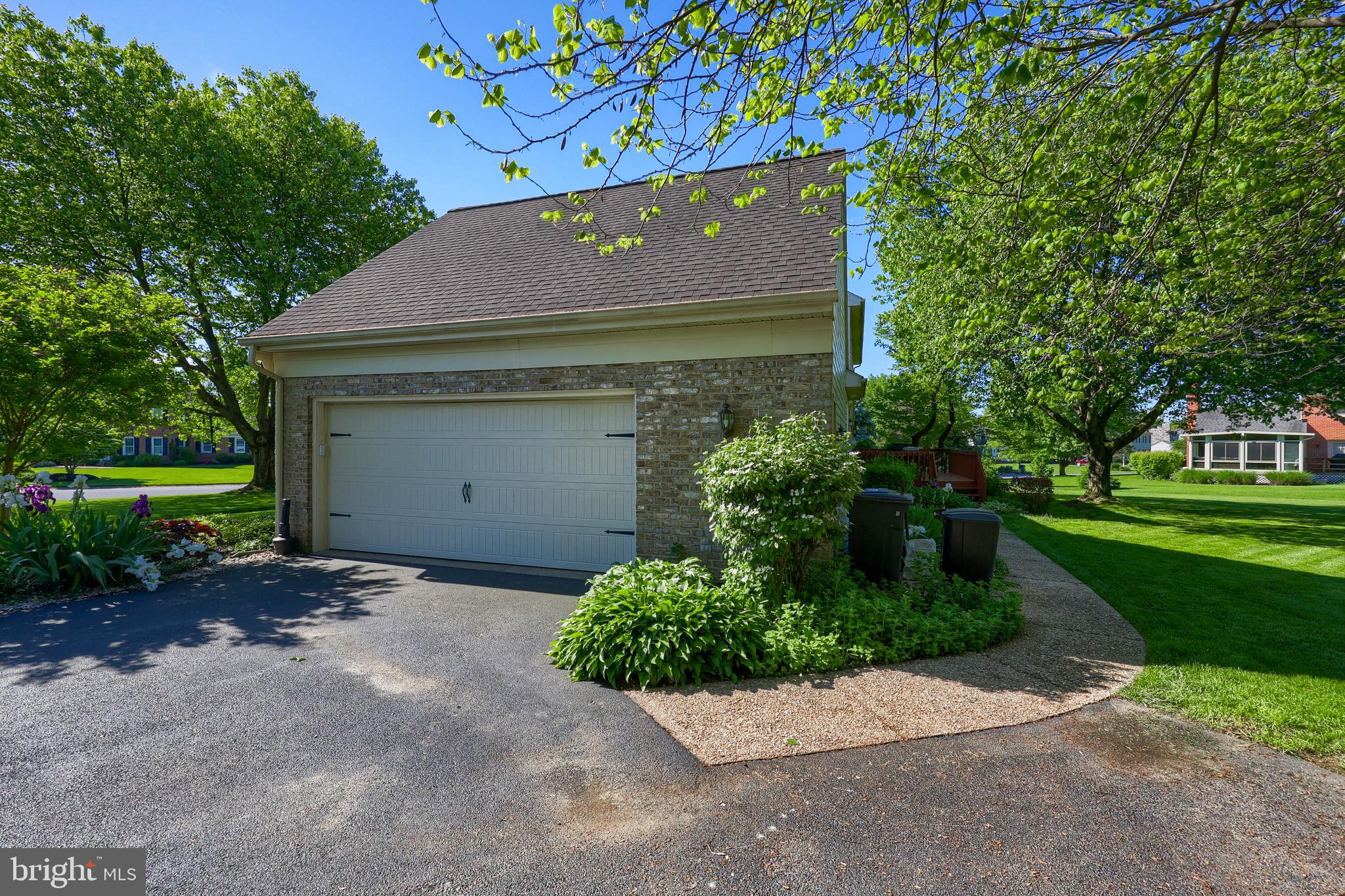 128 Hammersmith Lane Lititz, PA 17543 - Photo 56 of 65 a view of a house with a yard and garage