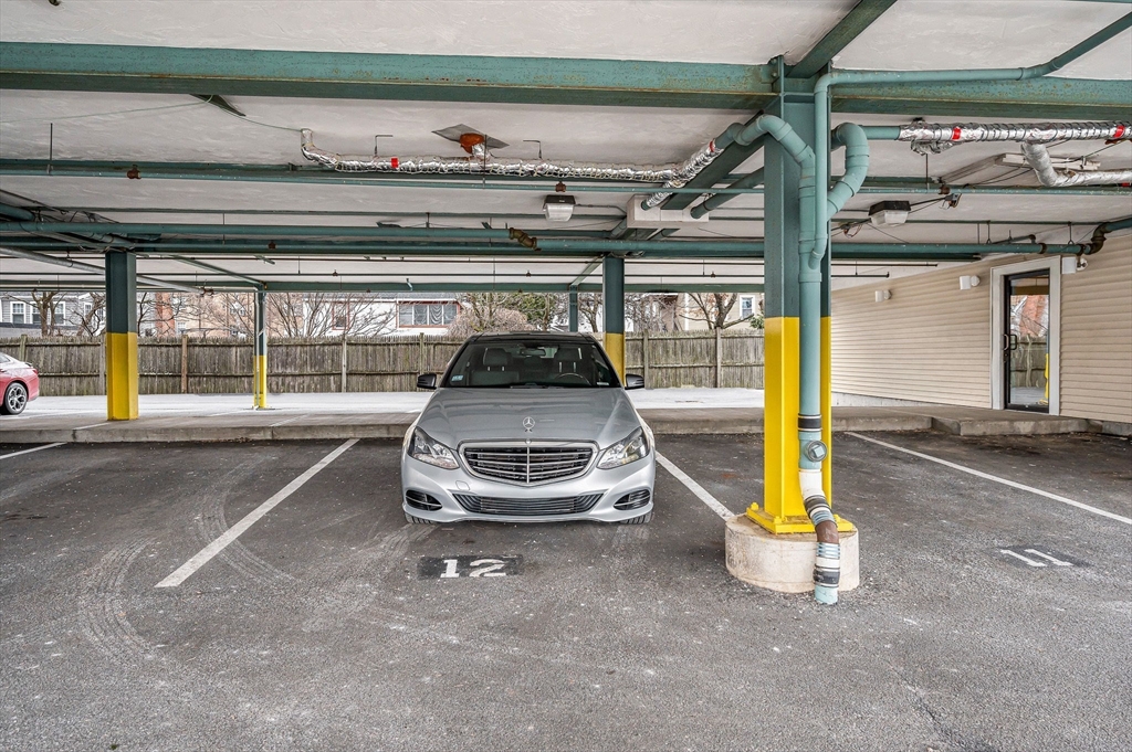 39 Broadway, Unit 305 Malden, MA 02148 - Photo 28 of 36 a car parked in a parking