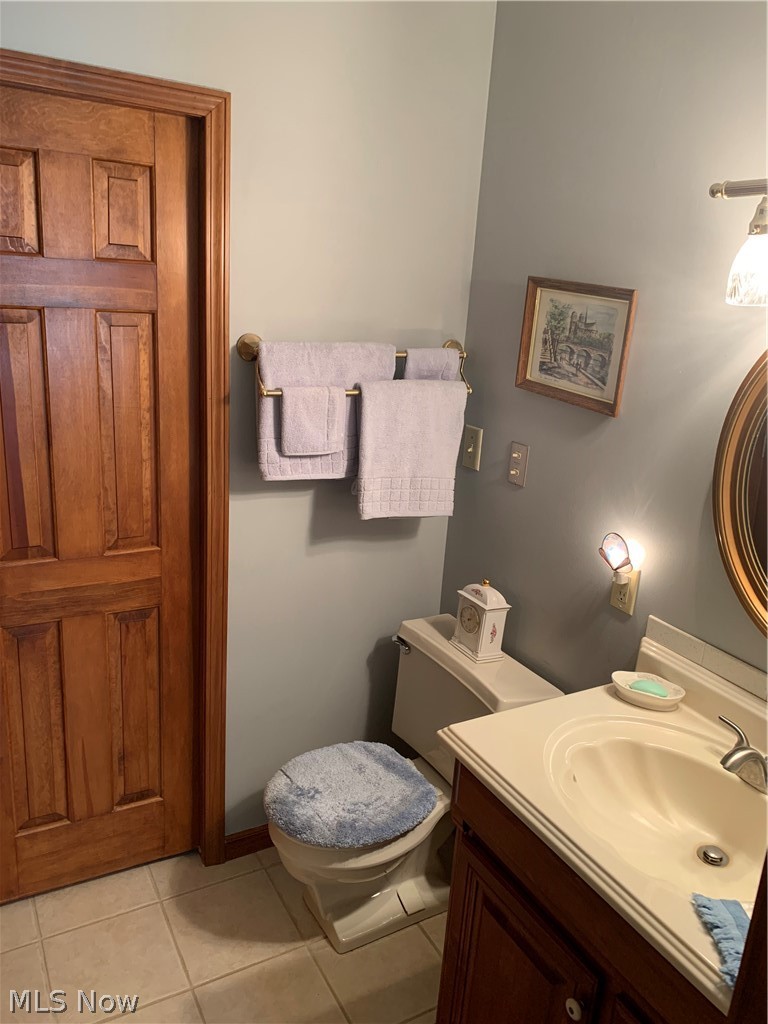 303 Orchard View Road Northeast Lancaster, OH 43130 - Photo 42 of 50 Bathroom with toilet, tile flooring, and vanity