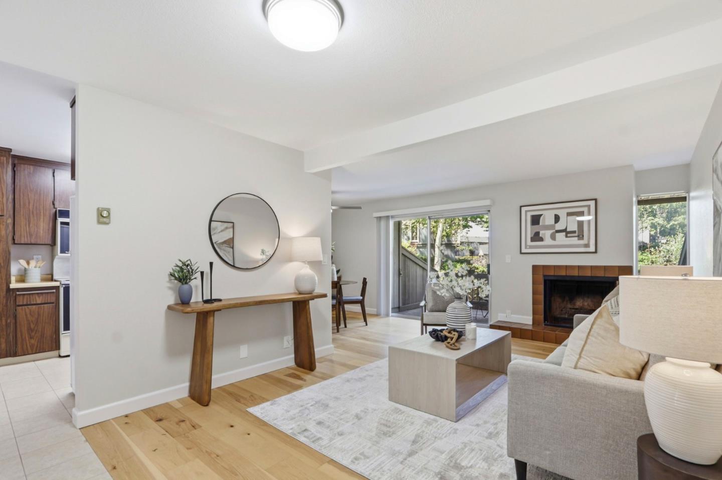 2252 Almaden Road, Unit A San Jose, CA 95125 - Photo 1 of 40 a living room with furniture a fireplace and a large window