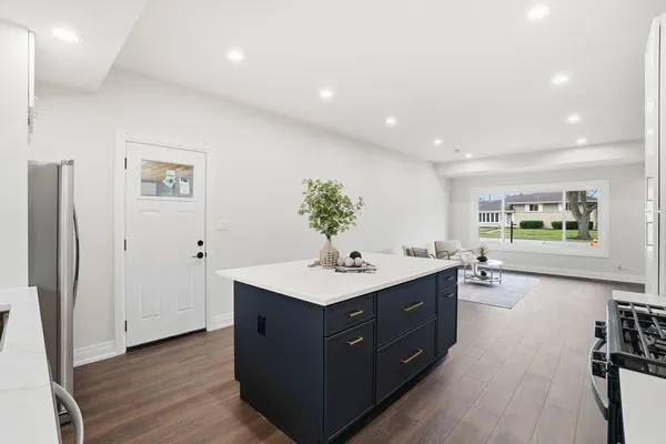 a kitchen with a sink and cabinets