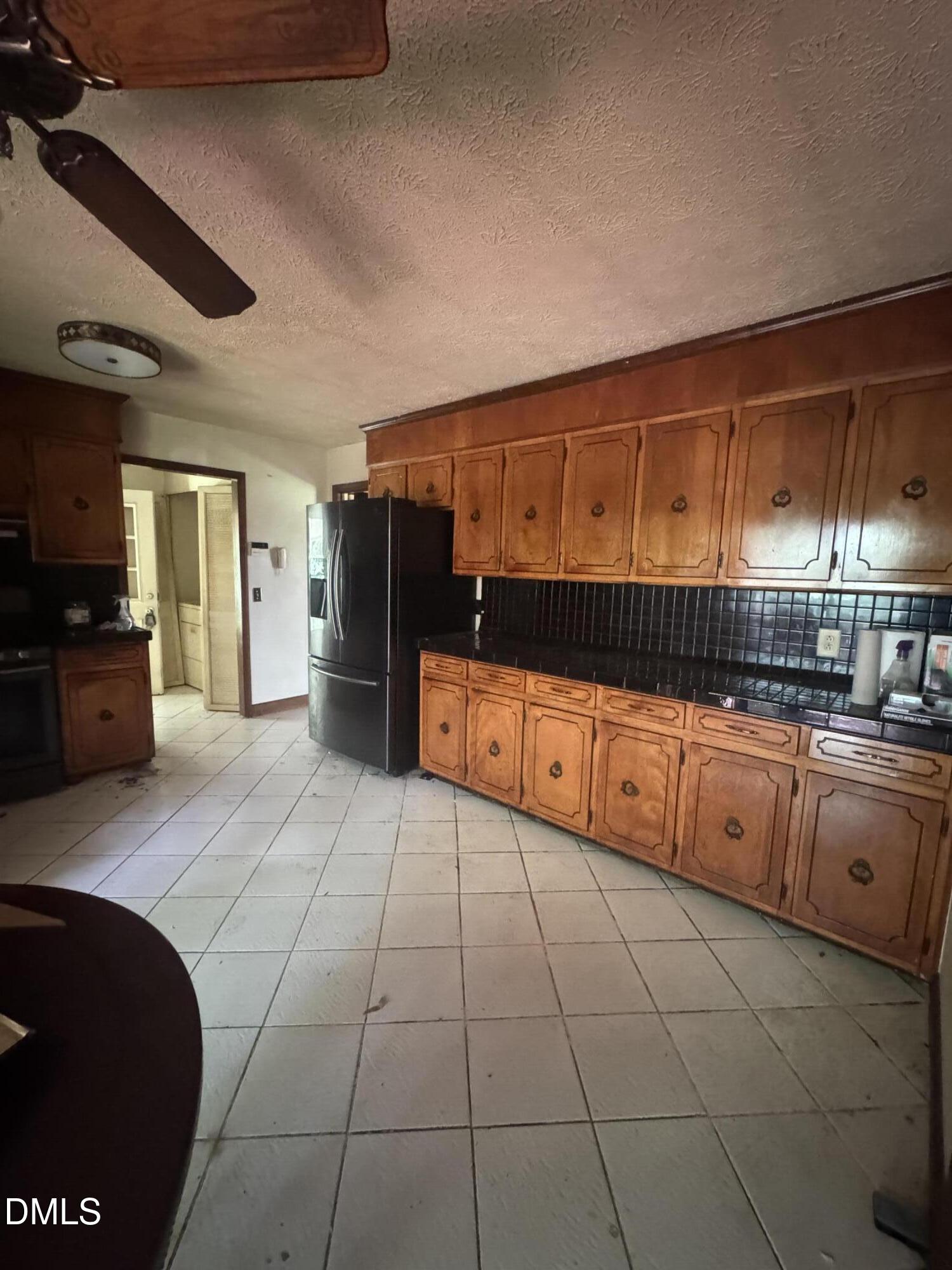 552 Clay Thomas Road Roxboro, NC 27573 - Photo 10 of 18 a kitchen with stainless steel appliances granite countertop a sink and cabinets