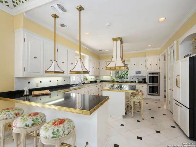 a living room with furniture pool table and a large window