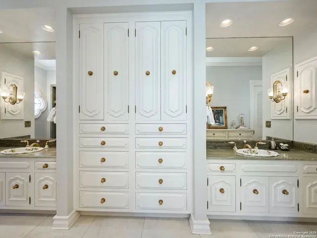 a living room with furniture a flat screen tv and a floor to ceiling window
