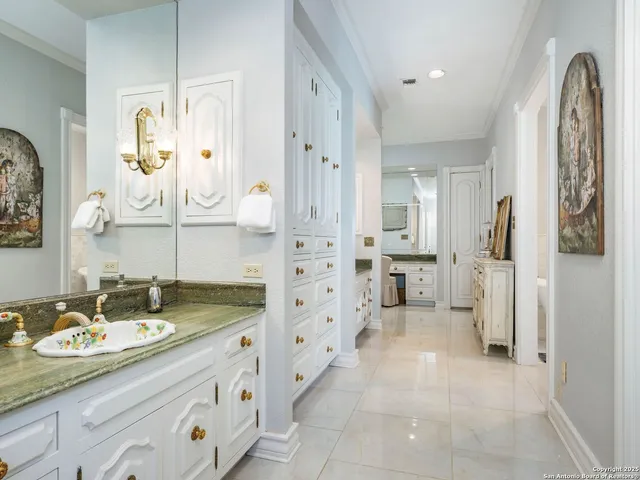 a kitchen with stainless steel appliances a stove a sink and a refrigerator