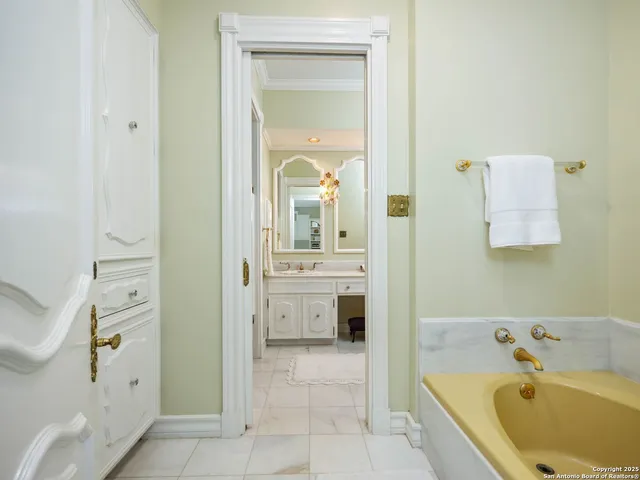 an aerial view of a house with a yard and lake view