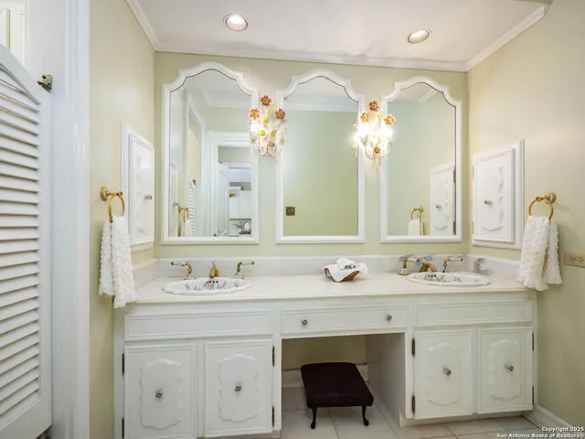 an aerial view of residential house with outdoor space and trees all around