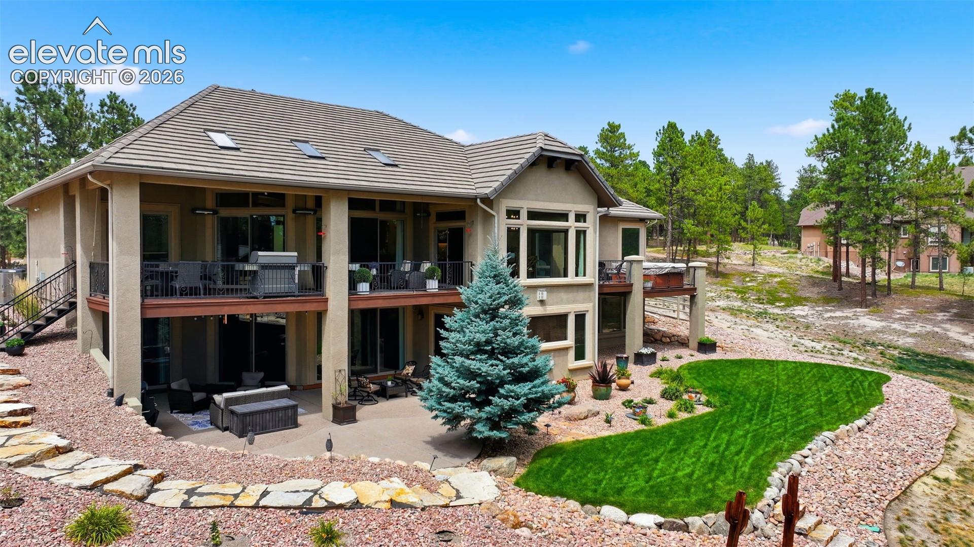 4865 Hidden Rock Road Colorado Springs, CO 80908 - Photo 45 of 50 Beautiful back yard with walks all around!