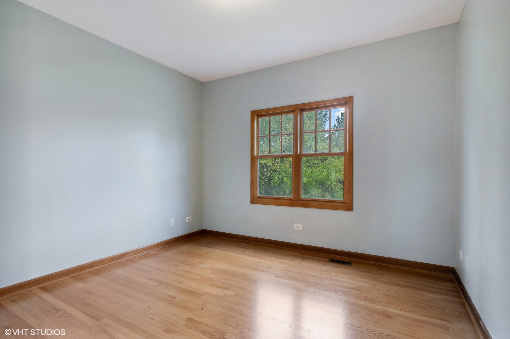2908 Beth Lane Naperville, IL 60564 - Photo 9 of 21 an empty room with wooden floor and windows