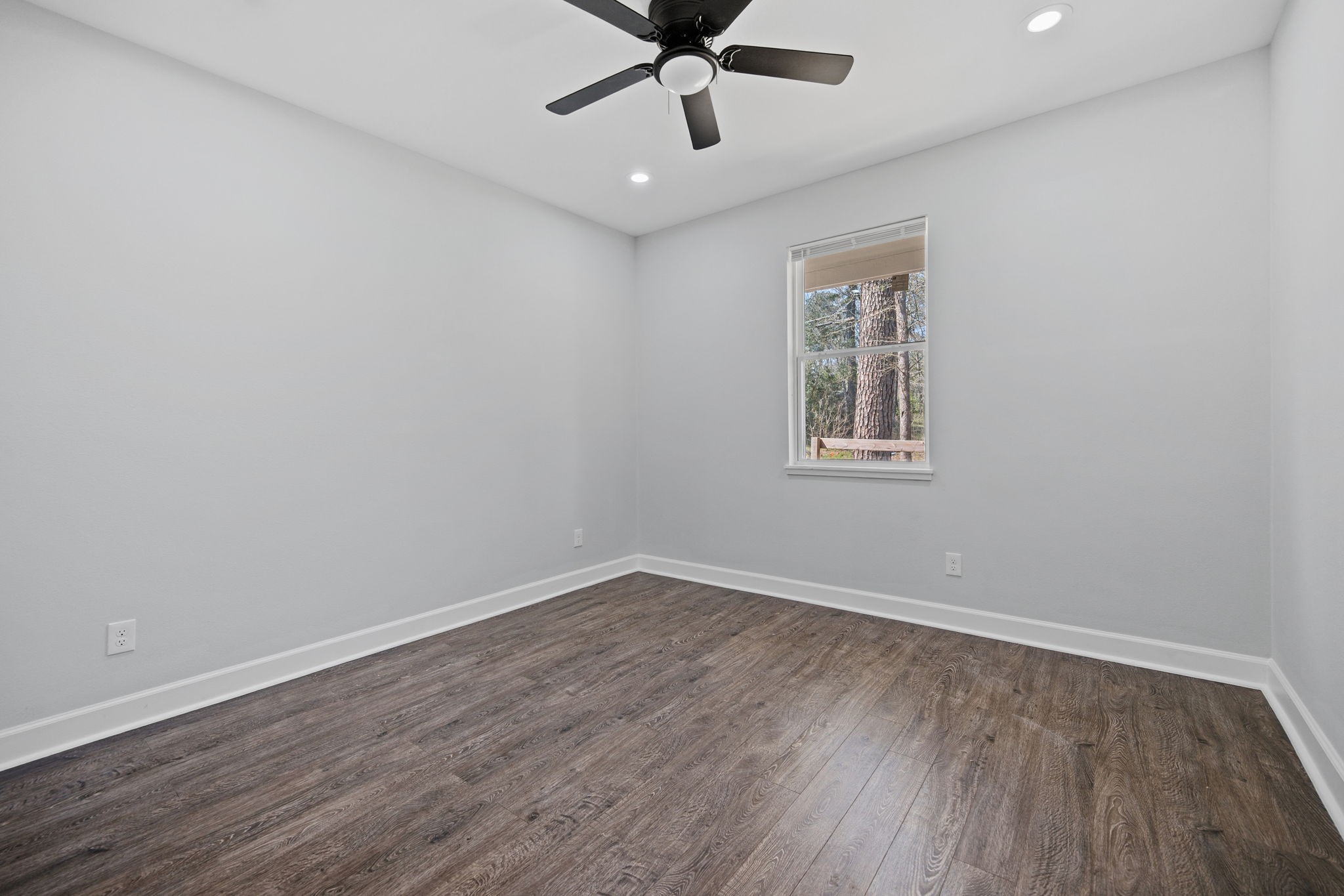 160 Oak Lane Shepherd, TX 77371 - Photo 16 of 22 wooden floor in an empty room with a window