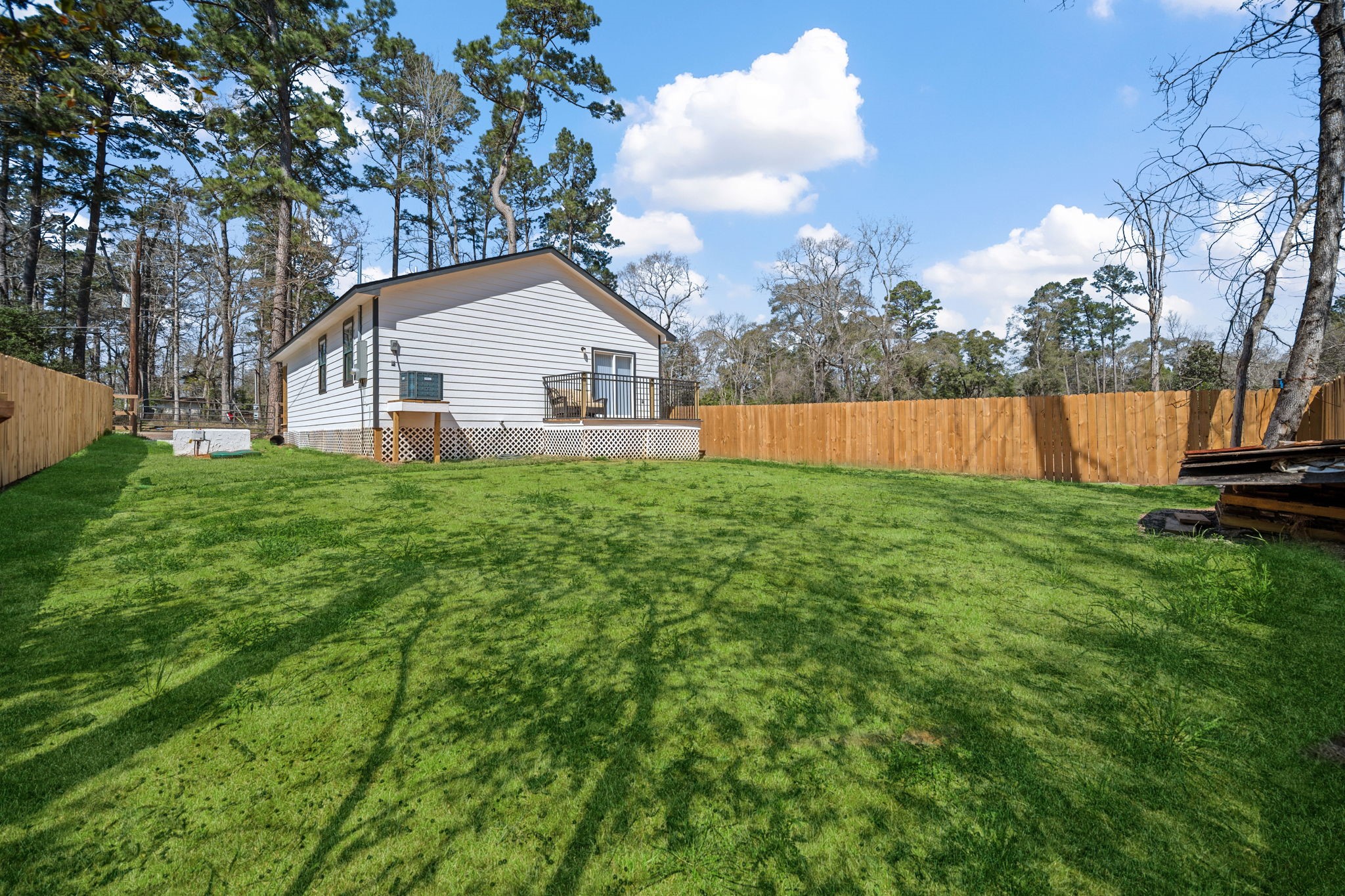 160 Oak Lane Shepherd, TX 77371 - Photo 21 of 22 a view of a house with a yard