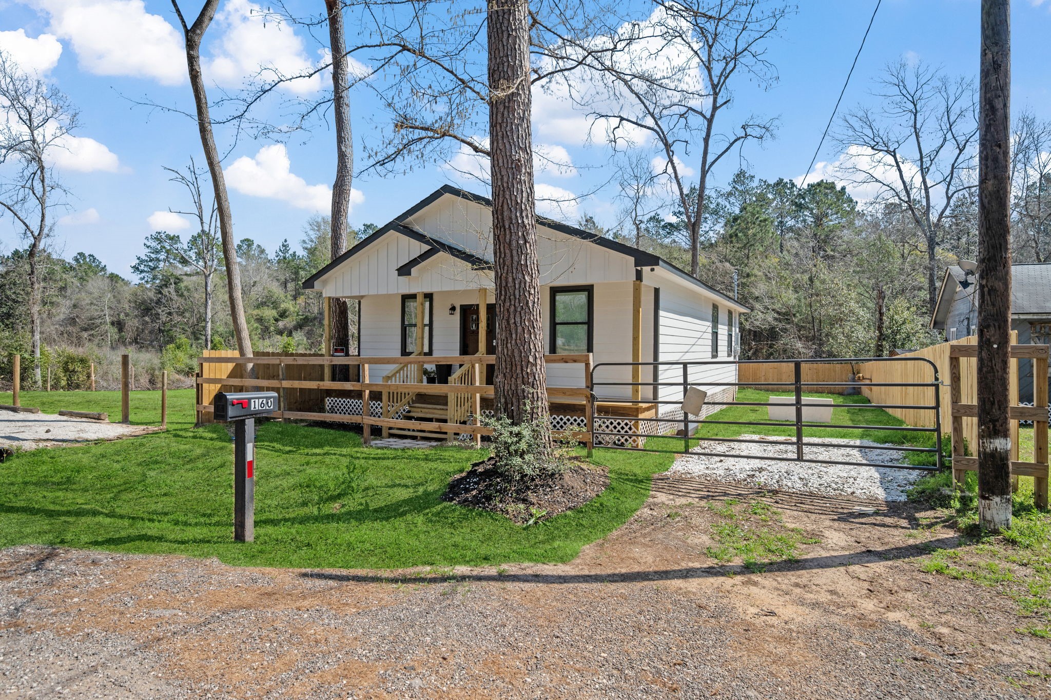 160 Oak Lane Shepherd, TX 77371 - Photo 22 of 22 a view of a house with backyard and porch