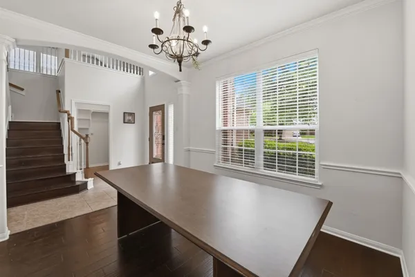 a view of a livingroom with a fireplace and wooden floor