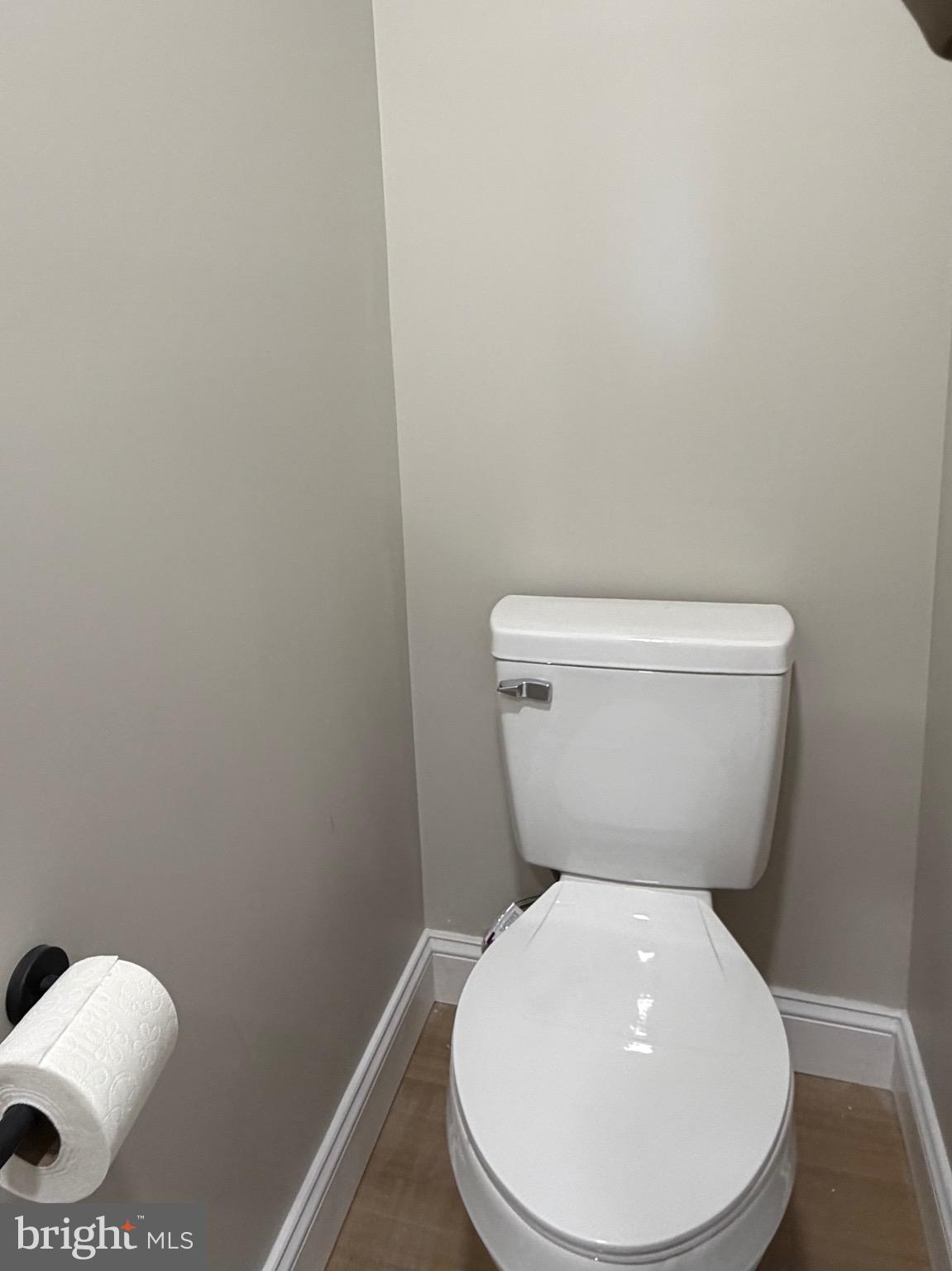 212 West Riverview Road Baltimore, MD 21225 - Photo 9 of 27 a white toilet sitting next to a white sink