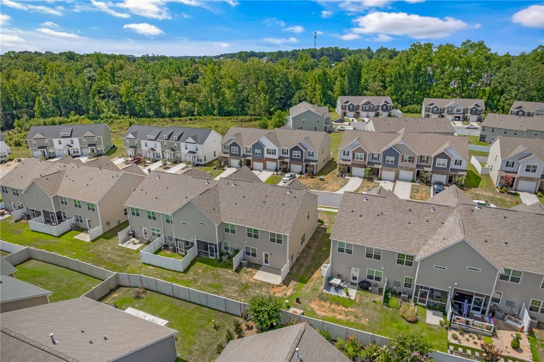 432 Bee Cv Way Pendleton, SC 29670 - Photo 34 of 39 An aerial view showcases a residential community nestled amidst lush green surroundings.