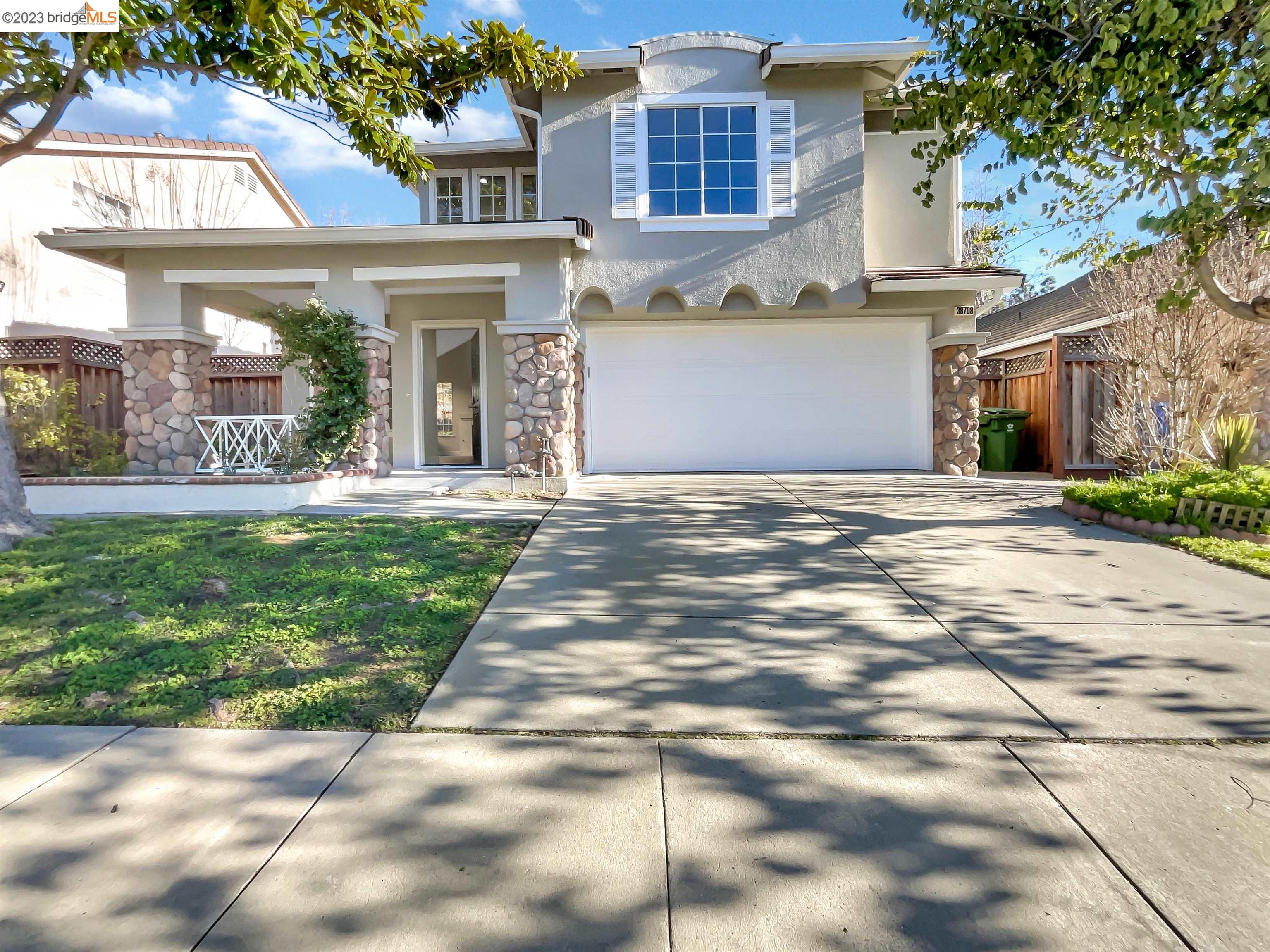 38708 Chimaera Circle Fremont, CA 94536 - Photo 1 of 1 a front view of a house with a yard and potted plants