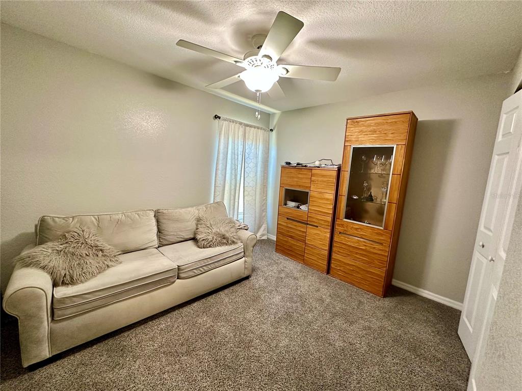 802 Marcia Loop Winter Haven, FL 33884 - Photo 13 of 48 a living room with furniture and a flat screen tv