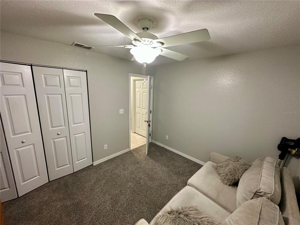 802 Marcia Loop Winter Haven, FL 33884 - Photo 14 of 48 a living room with furniture and a chandelier