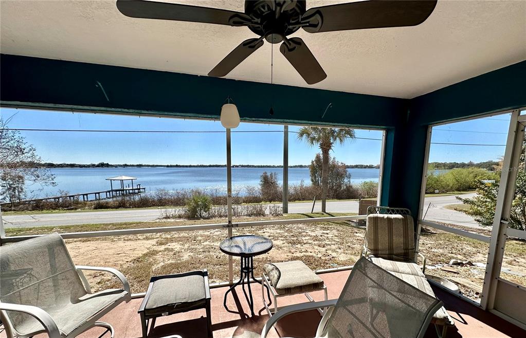 802 Marcia Loop Winter Haven, FL 33884 - Photo 20 of 48 a view of a swimming pool with a table and chairs in the patio