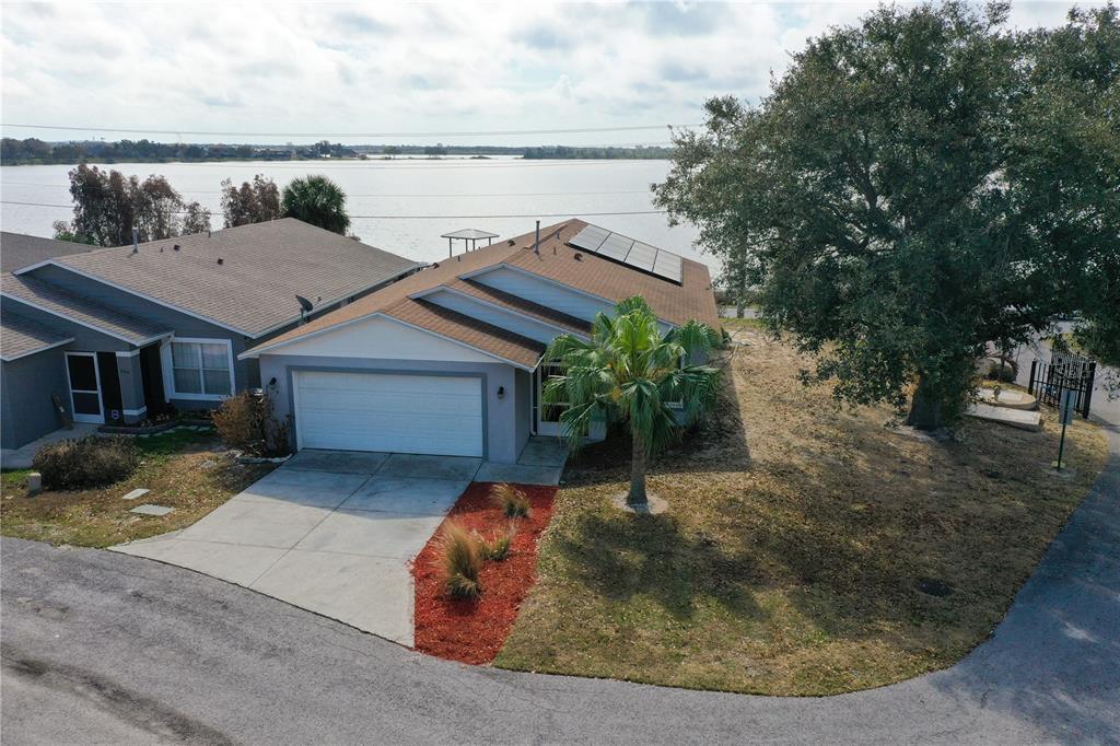 802 Marcia Loop Winter Haven, FL 33884 - Photo 2 of 48 a view of a house with a yard