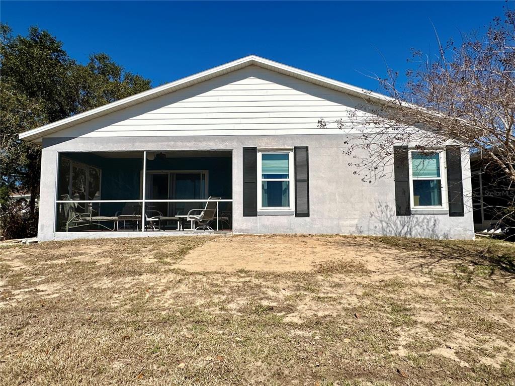 802 Marcia Loop Winter Haven, FL 33884 - Photo 27 of 48 a house with yard in front of it