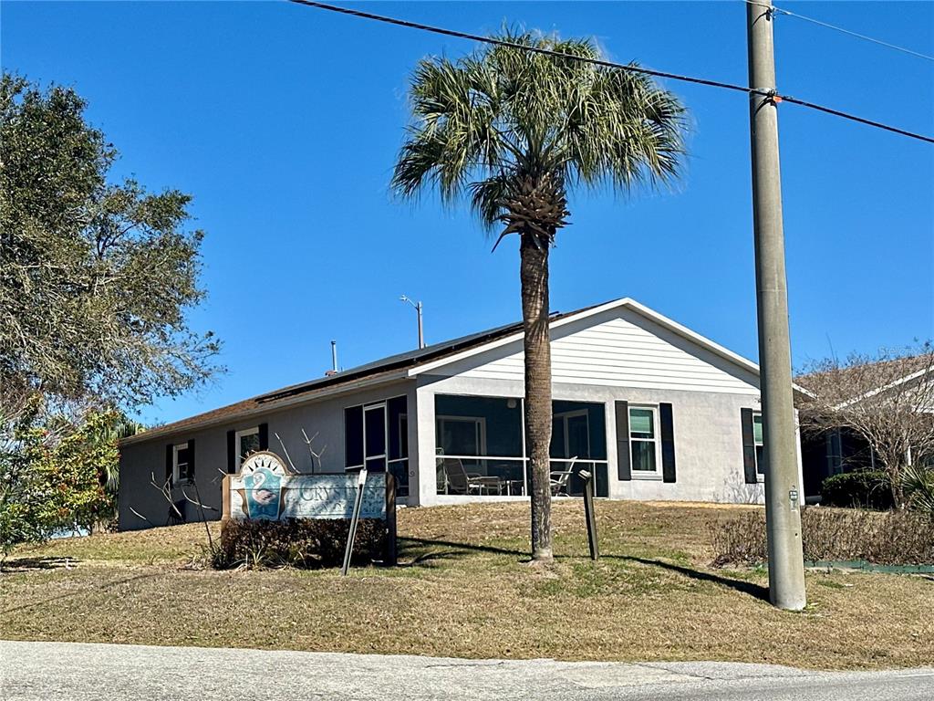 802 Marcia Loop Winter Haven, FL 33884 - Photo 30 of 48 a front view of a house with garden