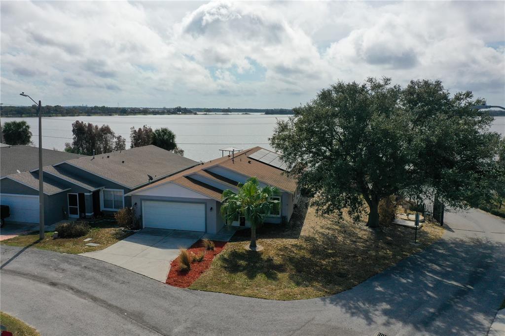 802 Marcia Loop Winter Haven, FL 33884 - Photo 34 of 48 a aerial view of a house with a yard and large tree