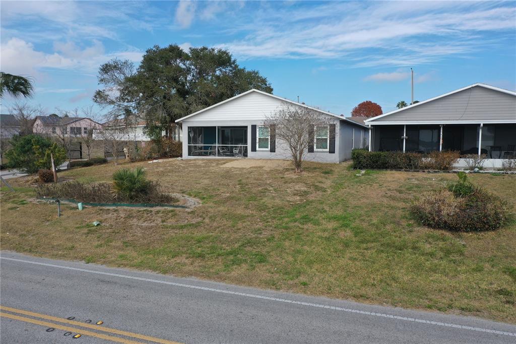 802 Marcia Loop Winter Haven, FL 33884 - Photo 41 of 48 a front view of a house with a yard