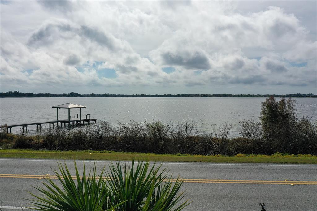 802 Marcia Loop Winter Haven, FL 33884 - Photo 44 of 48 a view of a terrace with a lake