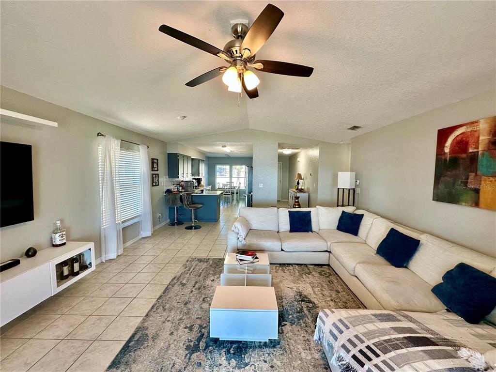 802 Marcia Loop Winter Haven, FL 33884 - Photo 5 of 48 a living room with furniture and a flat screen tv