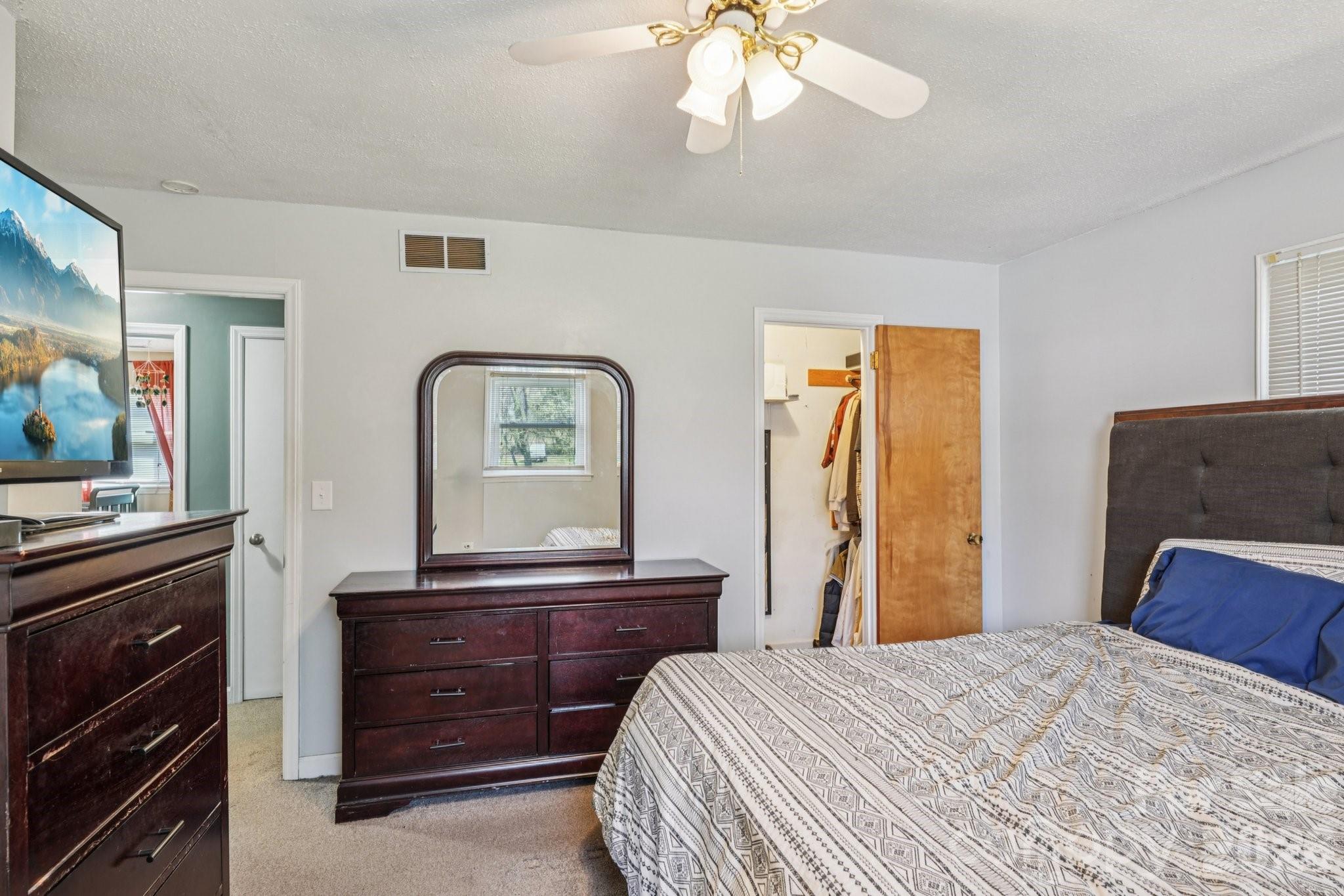 660 South Peace Haven Road Winston-Salem, NC 27103 - Photo 17 of 43 a bedroom with a bed and a dresser