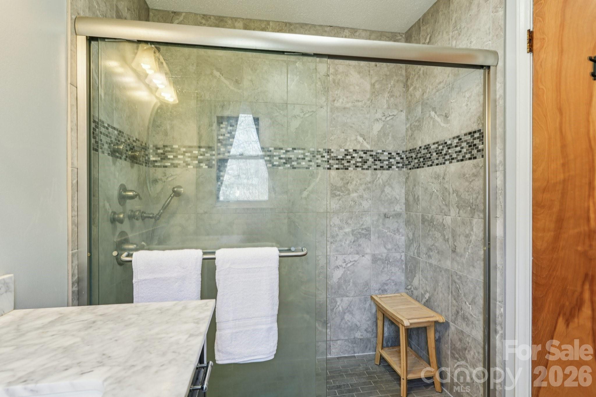 660 South Peace Haven Road Winston-Salem, NC 27103 - Photo 19 of 43 a bathroom with a shower