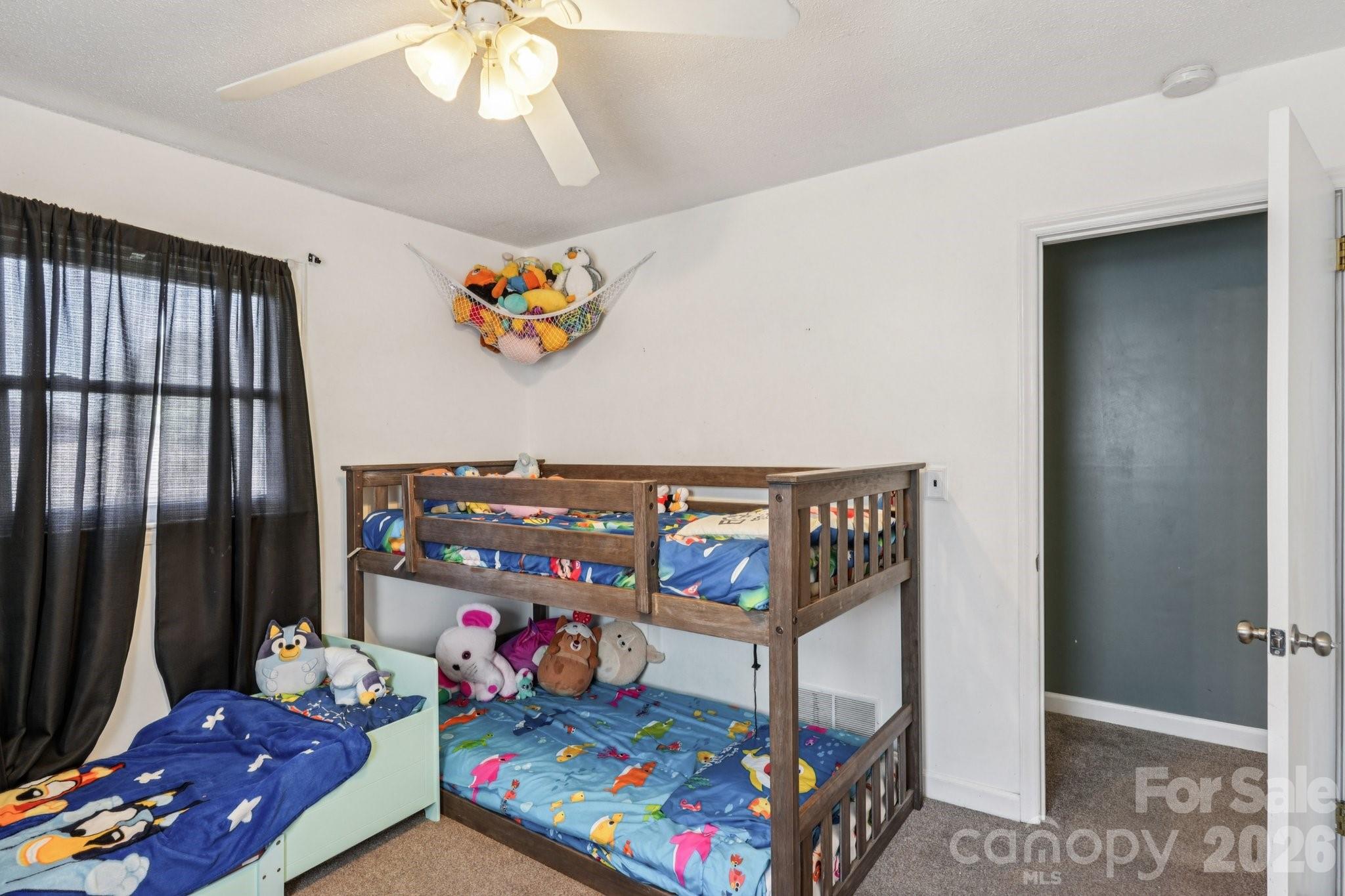 660 South Peace Haven Road Winston-Salem, NC 27103 - Photo 23 of 43 a bedroom with baby crib and hanging chair