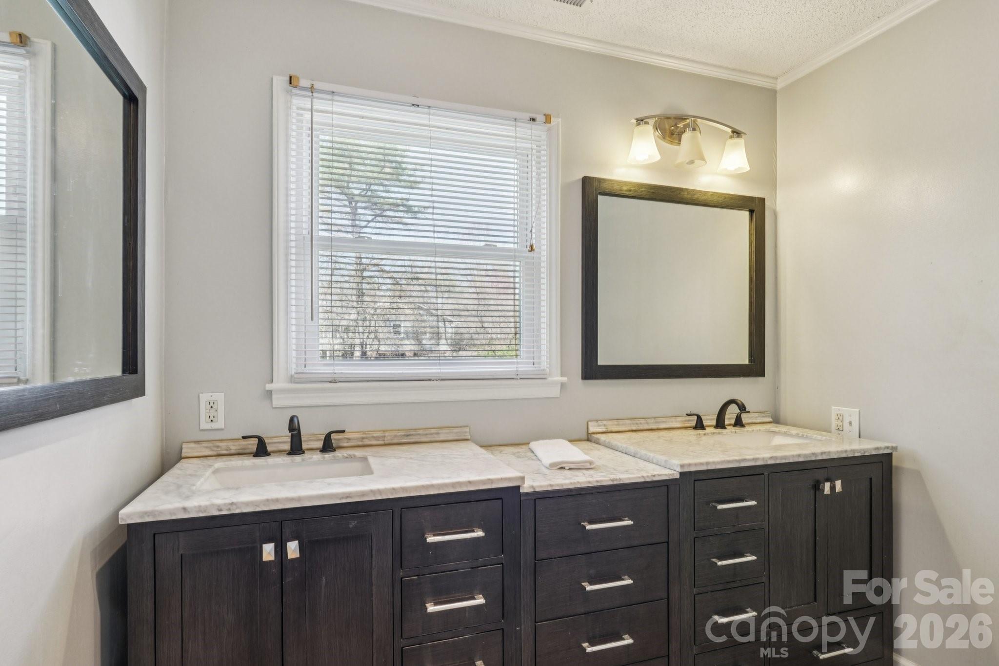 660 South Peace Haven Road Winston-Salem, NC 27103 - Photo 24 of 43 a bathroom with a granite countertop sink and a mirror