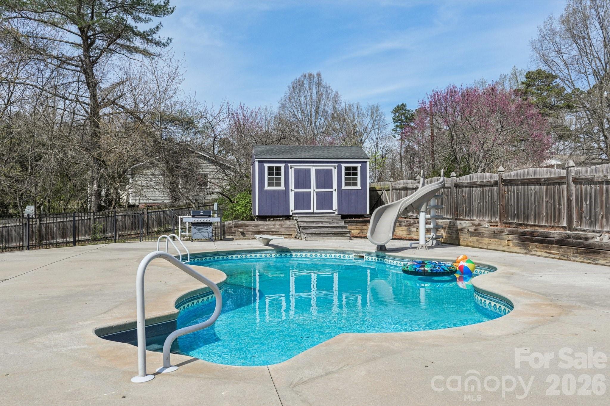 660 South Peace Haven Road Winston-Salem, NC 27103 - Photo 30 of 43 a swimming pool with outdoor seating and yard