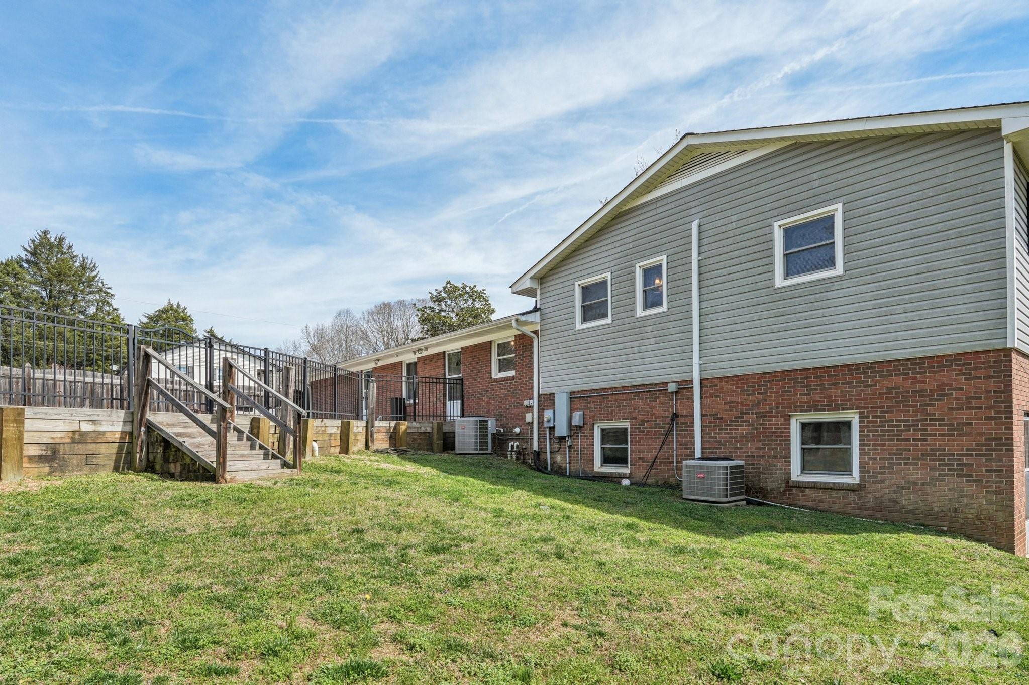 660 South Peace Haven Road Winston-Salem, NC 27103 - Photo 33 of 43 a view of a house with a yard