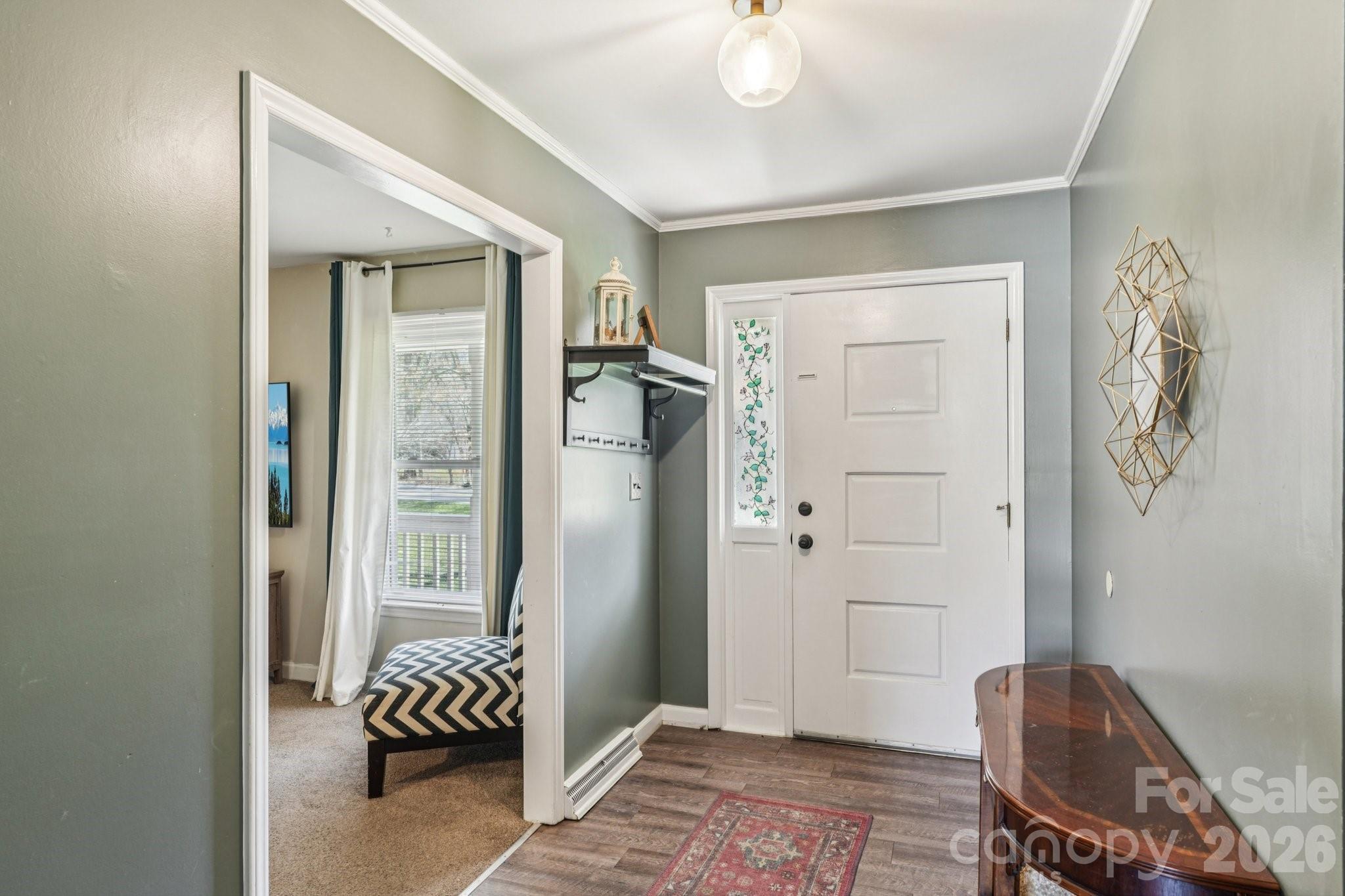 660 South Peace Haven Road Winston-Salem, NC 27103 - Photo 5 of 43 a view of room with furniture and wooden floor