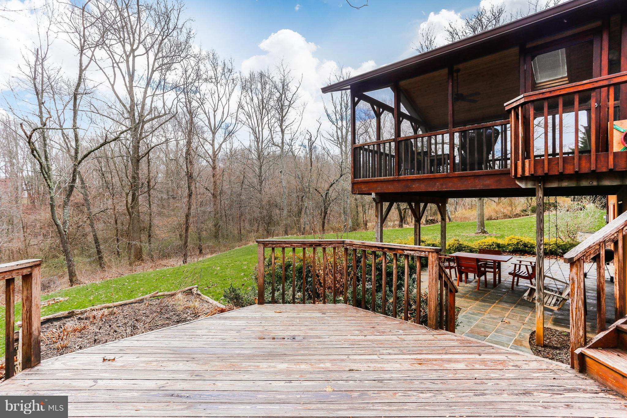 1713 Gamewell Road Silver Spring, MD 20905 - Photo 30 of 30 a balcony with wooden floor and outdoor seating