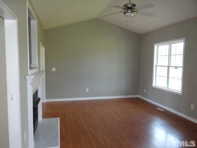 Massive Living Room Area w/ Cathedral Ceiling, Fireplace, and Tremendous Natural Light!