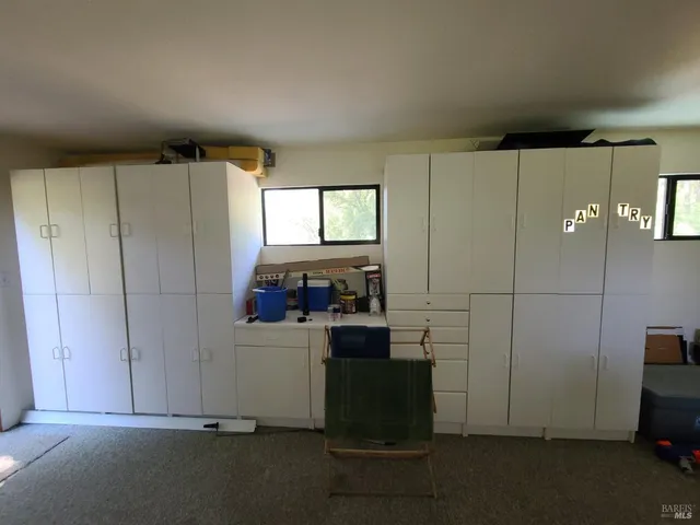 a bathroom with a sink toilet and window