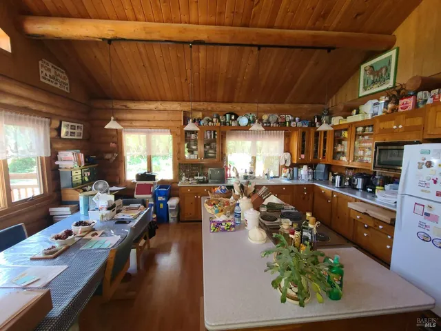 a view of staircase with wooden floor and furniture