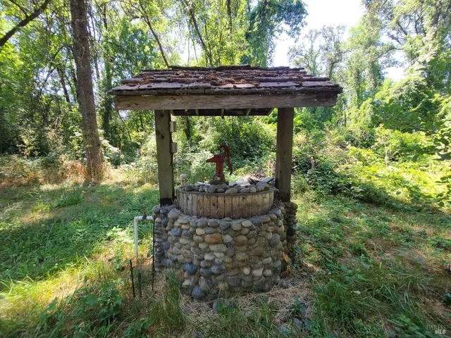 a view of backyard with sitting area