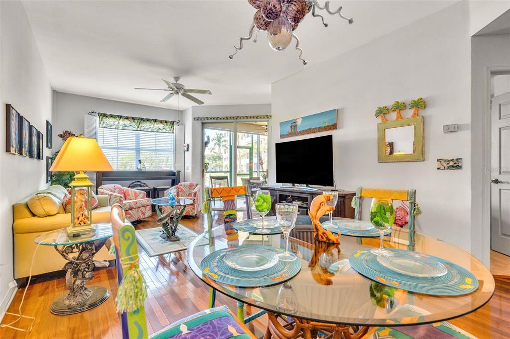 2090 Matecumbe Key Road, Unit 1105 Punta Gorda, FL 33955 - Photo 18 of 58 a living room with patio furniture and a flat screen tv