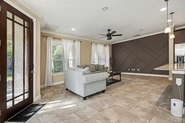 a living room with furniture and a window