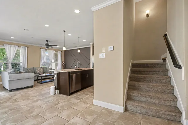 a view of living room with furniture and stairs