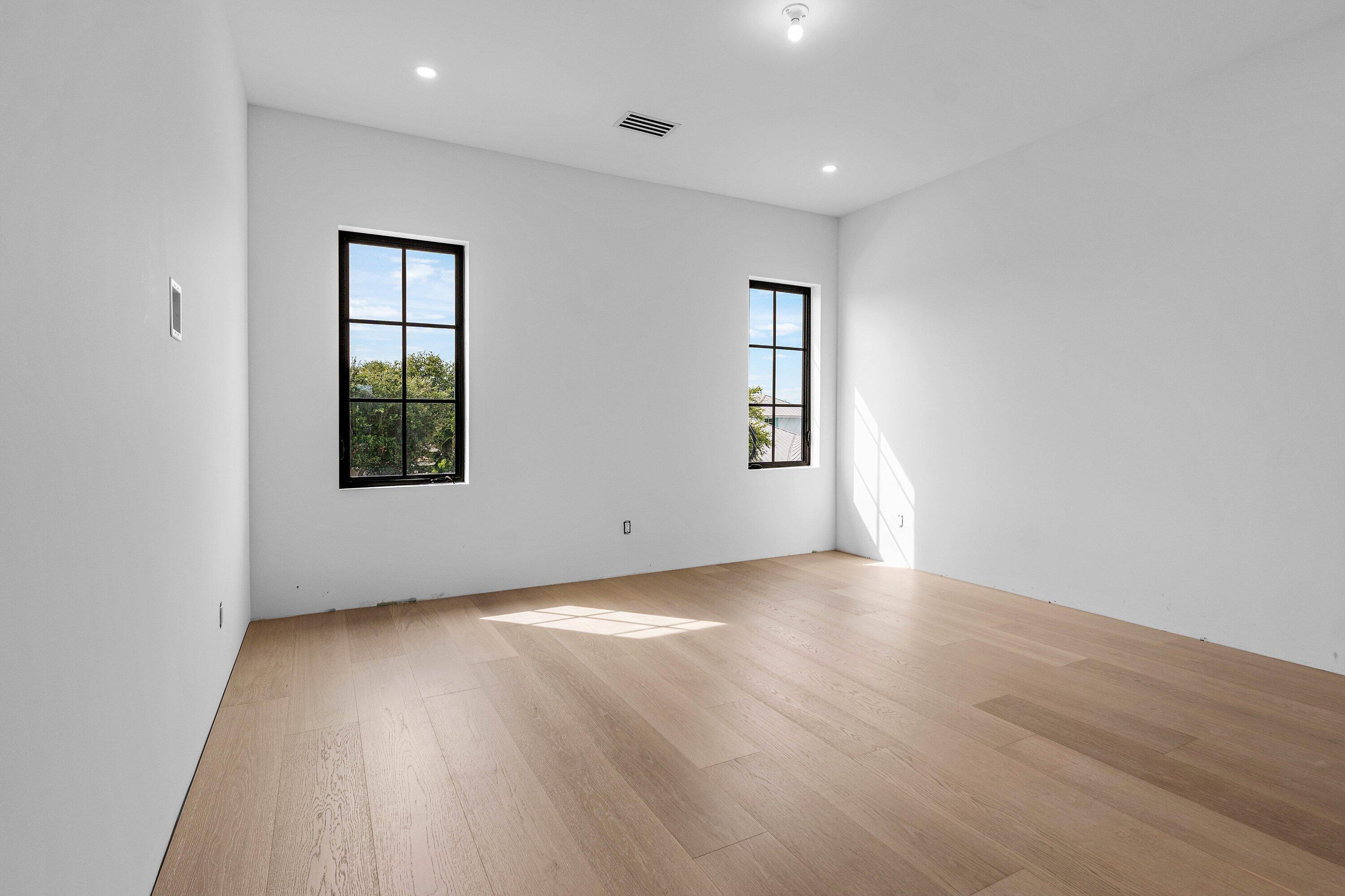 298 Northeast 8th Street Boca Raton, FL 33432 - Photo 50 of 86 an empty room with wooden floor and windows