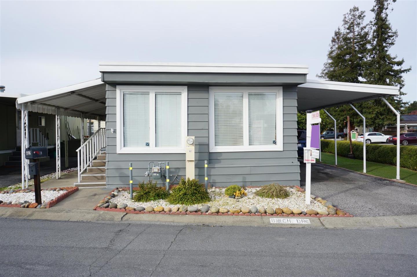 front view of a house with a bench